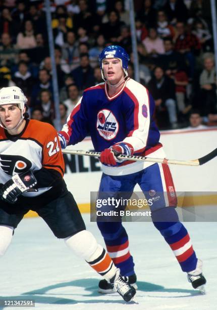 Jim Kyte of the Winnipeg Jets defends against Rick Tocchet of the Philadelphia Flyers during their game on January 30, 1988 at the Spectrum in...