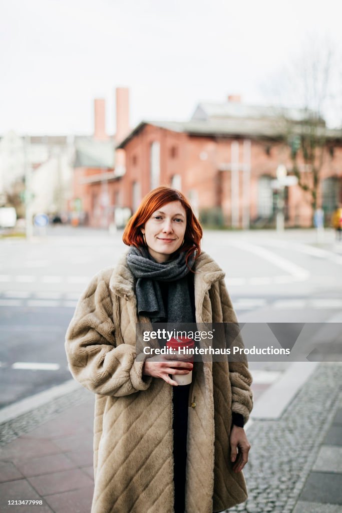 Portrait Of Woman Wearing Winter Coat In Street