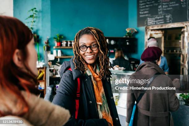 some people waiting in line at cafe counter - group of people cafe stock-fotos und bilder