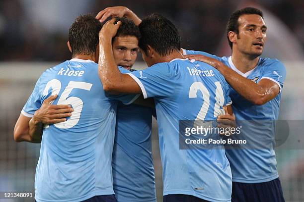 Hernanes with his teammates of SS Lazio celebrates after scoring the opening goal during the UEFA Europa League playoff first leg match between S.S....
