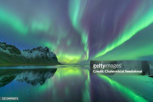 northern lights in iceland - north stock pictures, royalty-free photos & images
