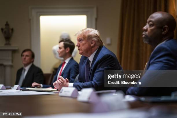 Senator Tim Scott, a Republican from South Carolina, from right, U.S. President Donald Trump, and Jared Kushner, senior White House adviser, listen...