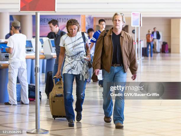 Jeff Daniels and his wife Kathleen Treado are seen at Los Angeles International Airport on May 15, 2011 in Los Angeles, California.
