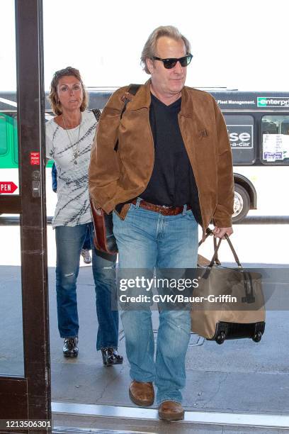 Jeff Daniels and his wife Kathleen Treado are seen at Los Angeles International Airport on May 15, 2011 in Los Angeles, California.