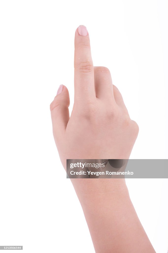 Female hand with french manicure pointing with finger, isolated on white background