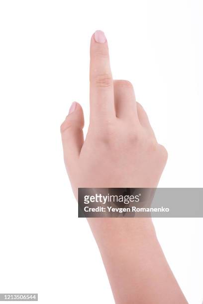female hand with french manicure pointing with finger, isolated on white background - menschlicher arm stock-fotos und bilder
