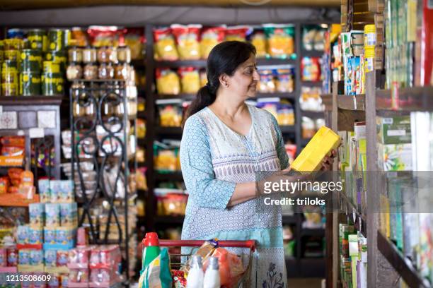 woman shopping at grocery store - shop stock pictures, royalty-free photos & images