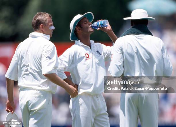 Alan Mullally , Dean Headley and twelfth man Alex Tudor during a drinks break in the 3rd Test match between Australia and England at the Adelaide...