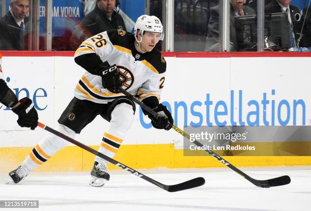 Par Lindholm of the Boston Bruins skates the puck against the Philadelphia Flyers on March 10, 2020 at the Wells Fargo Center in Philadelphia,...