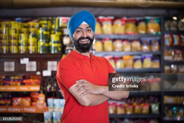 sikh man at grocery store products - turban stock pictures, royalty-free photos & images