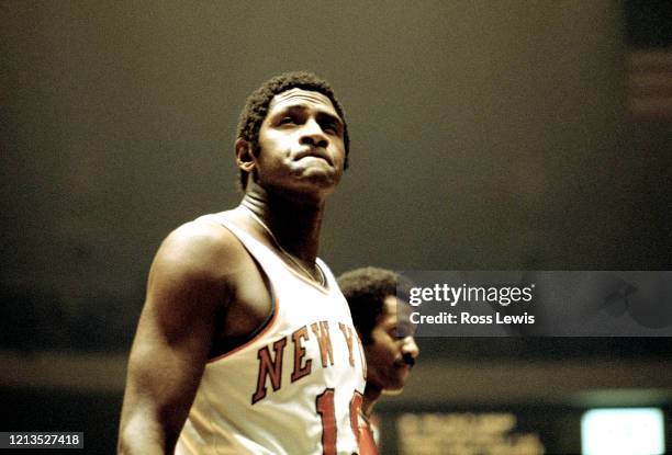 Willis Reed, Center, of the New York Knicks grimaces while waiting for the Boston Celtics to shoot free-throws during an NBA basketball game at...