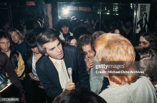 American television personality Tom Snyder interviews Chuck E Starr at Rodney Bingenheimer's English Disco in Los Angeles, USA, circa 1974.