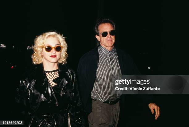 American singer Madonna and actor Warren Beatty in New York City, 24th June 1990.