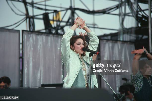 American singer Madonna takes part in the Live Aid benefit concert at the John F Kennedy Stadium in Philadelphia, USA, 13th July 1985.