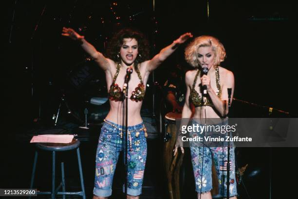 American singer Madonna and actress Sandra Bernhard perform at the Don't Bungle the Jungle benefit concert at the Brooklyn Academy of Music in New...