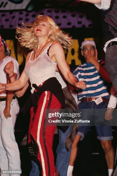 American singer Madonna takes part in a Dance-A-Thon event in support of the AIDS Project Los Angeles, USA, 12th April 1991.