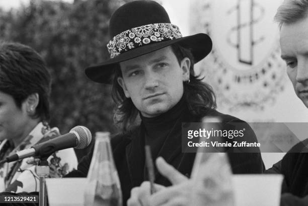Irish singer Bono during a press conference for the Conspiracy of Hope benefit concerts in aid of Amnesty International, USA, June 1986. Singer Sting...