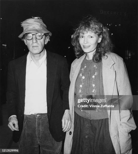 American actor and filmmaker Woody Allen with his partner, actress Mia Farrow, after seeing the Broadway play 'Loot' in New York City, 1986.