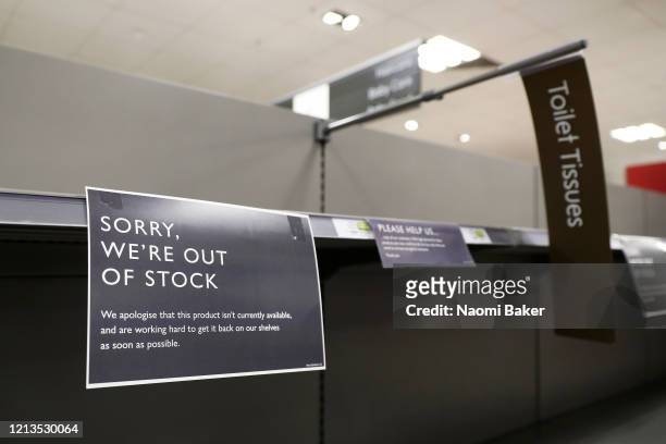 Out of Stock' signs are seen inside a Waitrose supermarket on March 19, 2020 in Southampton, United Kingdom. After spates of "panic buying" cleared...