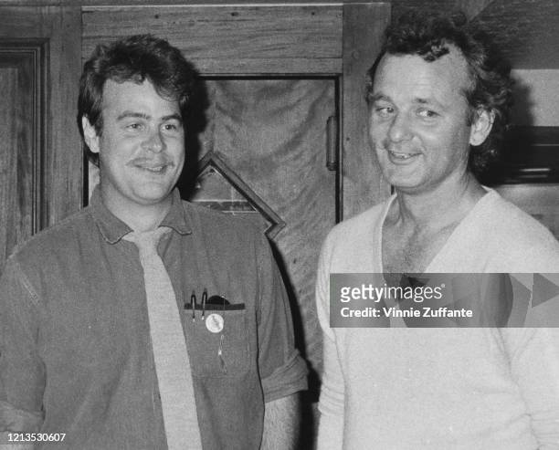 Actors Dan Aykroyd and Bill Murray at the Hard Rock Cafe in New York City, circa 1985. They are celebrating the beginning of summer.