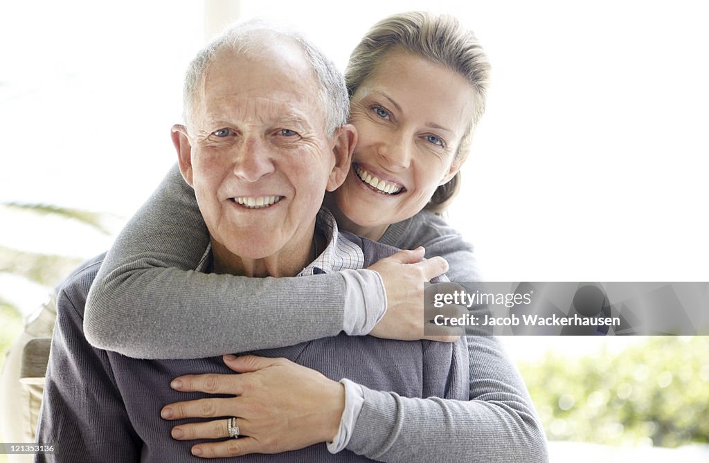 Beautiful young woman embracing her father