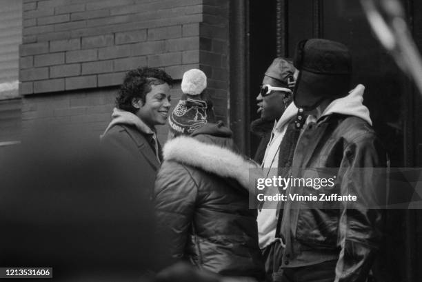 American singer Michael Jackson during the filming of the music video for his song 'Bad' in New York City, USA, 1986. Actor Wesley Snipes plays the...