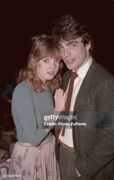 American actor Peter Gallagher, star of the film 'The Idolmaker', with a young woman, USA, 1980.