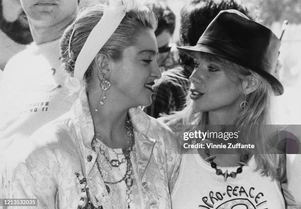 American singer and actress Madonna with actress Rosanna Arquette during a Pro-Peace rally in Van Nuys, Los Angeles, California, 5th October 1985.