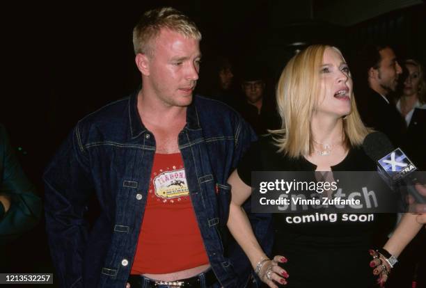 American singer and actress Madonna wearing a 'Snatch Coming Soon' t-shirt at a launch party for her new album 'Music' in Los Angeles, California,...