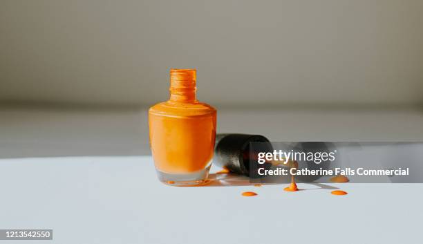 dripping nail polish - nail varnish stockfoto's en -beelden