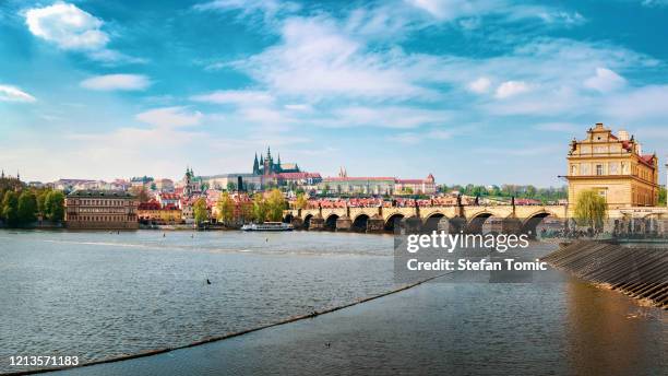 prague cityscape with charles bridge from vltava river - czech republic skyline stock pictures, royalty-free photos & images