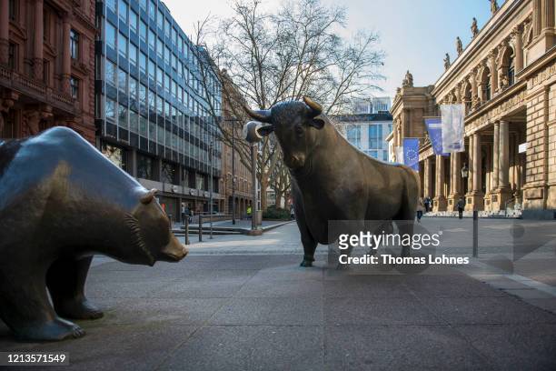 Bull statue and a bear statue stand outside the Frankfurt Stock Exchange on March 19, 2020 in Frankfurt, Germany. Restrictions from the state of...