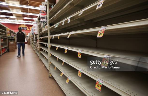 Section of empty shelves is seen during special shopping hours only open to seniors and the disabled at Northgate Gonzalez Market, a Hispanic...