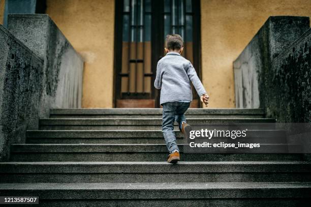 kid running on stairs - child running up stairs stock pictures, royalty-free photos & images