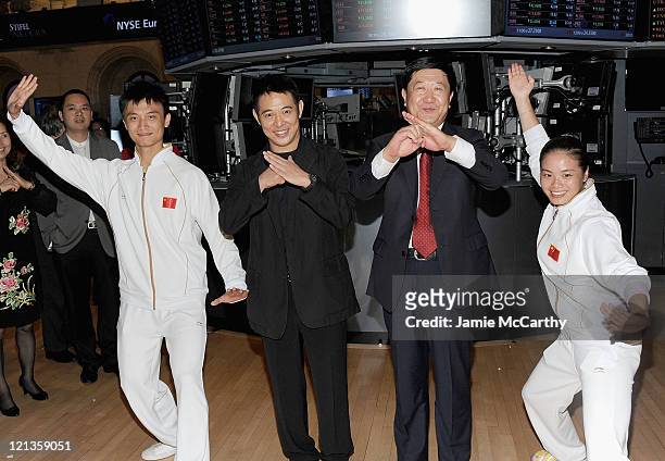 Actor Jet Li and Vice President of the Chinese Wushu Association He Qinglong ring the closing bell at the New York Stock Exchange on August 18, 2011...