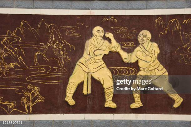 mural of two kung fu fighters, shaolin temple, china - kung fu 個照片及圖片檔