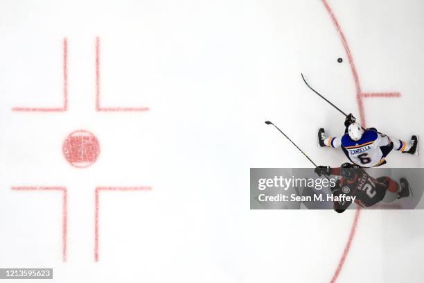 David Backes of the Anaheim Ducks battles Marco Scandella of the St. Louis Blues for a loose puck during the second period of a game at Honda Center...