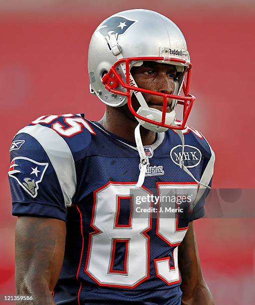 Receiver Chad Ochocinco of the New England Patriots warms up just prior to the start of the preseason game against the Tampa Bay Buccaneers at...