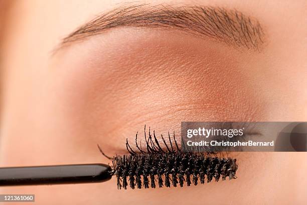 close-up female applying mascara - applying mascara stock pictures, royalty-free photos & images