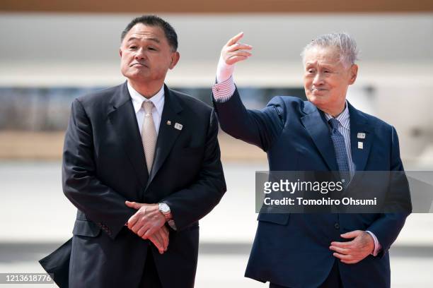 Tokyo Olympic and Paralympic Organizing Committee President Yoshiro Mori gestures as he stands with Japan Olympic Committee President Yasuhiro...