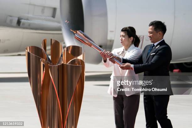Olympic gold medalists Tadahiro Nomura and Saori Yoshida light the Olympic flame during the Tokyo 2020 Olympic Games Flame Arrival Ceremony at the...