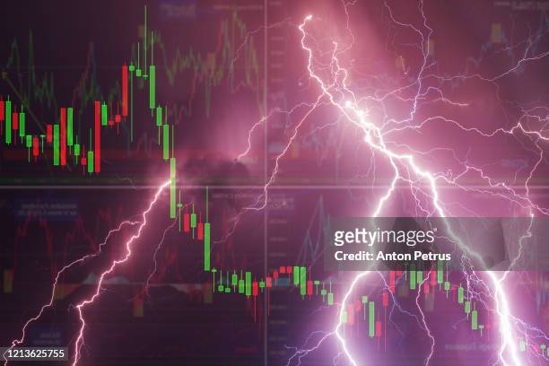 stock charts against the sky with lightning. world financial crisis concept - stock market crash stock-fotos und bilder