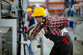 Factory worker with painful back injury stock photo
