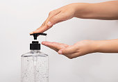 personal hygiene. people washing hand by hand sanitizer alcohol gel for cleaning and disinfection, prevention of spreading of germs during infections of COVID-19 Coronavirus outbreak situation