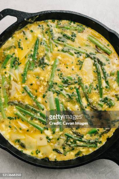 pre-baked egg and asparagus frittata still life - frittata stock pictures, royalty-free photos & images