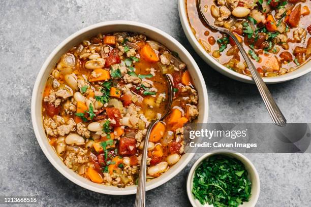 italian sausage and white bean soup - stew stock pictures, royalty-free photos & images