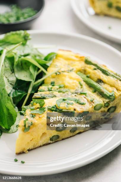 asparagus frittata wedge close up - frittata stock pictures, royalty-free photos & images