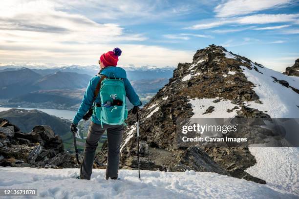 alpine hiking in snow covered mountains, the remarkables, new zealand - queenstown new zealand stock pictures, royalty-free photos & images