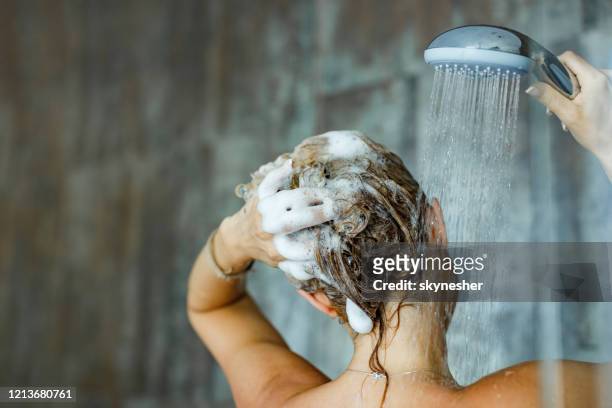 washing hair with shampoo! - women taking showers stock pictures, royalty-free photos & images