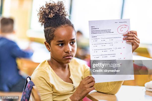 i've got a c minus on my exam! - child report card stock pictures, royalty-free photos & images